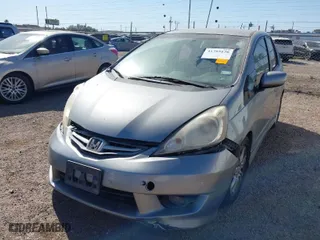 2009 Honda Fit Sport w/Navi with VIN JHMGE88619S020572, listed as a IAAI auction lot 41755126 with 202,358 mi miles. Bid and sale history available at carsss.com. Image 2.
