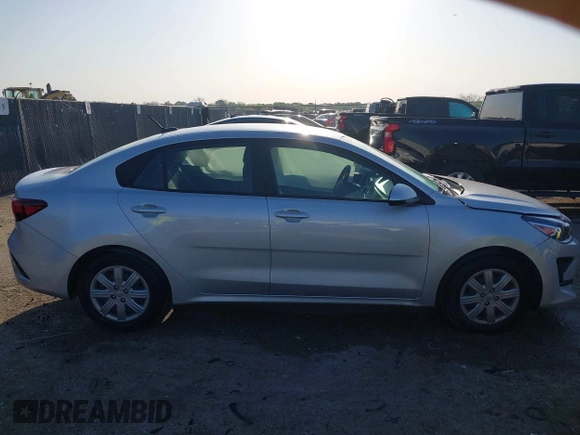 2023 Kia Rio S z VIN 3KPA24AD2PE545609, wystawiony jako IAAI lot #41993823 z przebiegiem 12 186 mil mil oraz . Historia ofert i sprzedaży dostępna na DreamBid. Obrazek 13.