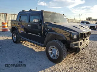 2005 Hummer H2 SUT with VIN 5GRGN22U85H109003, listed as a Copart auction lot 76557734 with 115,249 mi miles and Salvage Title. Bid and sale history available at carsss.com. Image 4.