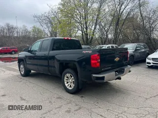 2014 Chevrolet Silverado 1500 LT with VIN 1GCVKREH1EZ169899, listed as a IAAI auction lot 42143501 with 124,789 mi miles and . Bid and sale history available at DreamBid. Image 3.
