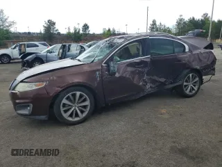 2009 Lincoln MKS z VIN 1LNHM93R89G601548, wystawiony jako Copart lot #54336075 z przebiegiem 318 143 mil mil oraz Szkoda całkowita • Salvage title. Historia ofert i sprzedaży dostępna na DreamBid. Obrazek 1.