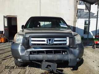 2007 Honda Pilot EX-L with VIN 5FNYF18777B012649, listed as a IAAI auction lot 42070873 with 167,419 mi miles and . Bid and sale history available at DreamBid. Image 12.