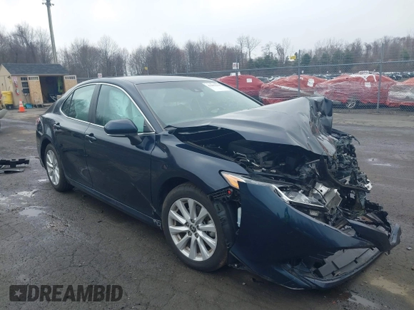 2020 Toyota Camry LE with VIN 4T1L11AK3LU977805, listed as a IAAI auction lot 41907558 with 82,237 mi miles and . Bid and sale history available at DreamBid. Image 1.