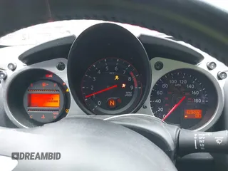 2014 Nissan 370Z Nismo z VIN JN1AZ4EH0EM631950, wystawiony jako IAAI lot #41685567 z przebiegiem 103 282 mil mil oraz . Historia ofert i sprzedaży dostępna na DreamBid. Obrazek 7.