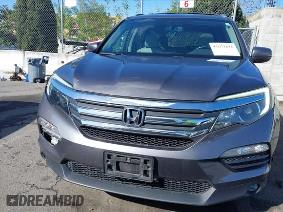 2017 Honda Pilot EX-L with VIN 5FNYF6H57HB021350, listed as a IAAI auction lot 41673635 with 101,980 mi miles and . Bid and sale history available at DreamBid. Image 12.