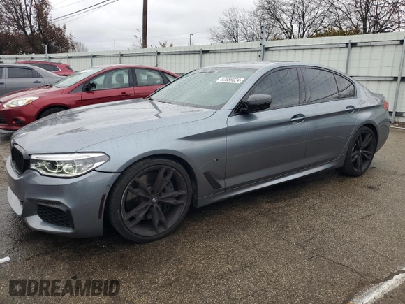 2018 BMW 5 Series M550i xDrive with VIN WBAJB9C54JB286707, listed as a Copart auction lot 49158435 with 74,307 mi miles and Salvage title. Bid and sale history available at DreamBid. Image 1.