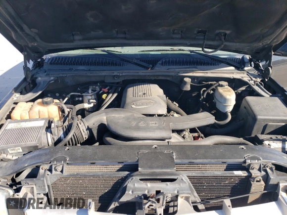 2004 Cadillac Escalade z VIN 1GYEC63T54R139039, wystawiony jako Copart lot #86274414 z przebiegiem 267 218 mil mil oraz Czysty tytuł • Clean title. Historia ofert i sprzedaży dostępna na DreamBid. Obrazek 13.