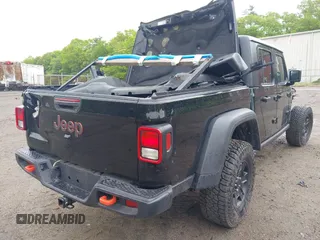 2021 Jeep Gladiator Mojave z VIN 1C6JJTEG9ML605638, wystawiony jako IAAI lot #40302253 z przebiegiem 32 019 mil mil oraz . Historia ofert i sprzedaży dostępna na DreamBid. Obrazek 4.