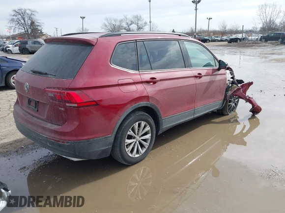 2018 Volkswagen Tiguan S with VIN 3VV1B7AX9JM085312, listed as a IAAI auction lot 41656827 with 122,322 mi miles and . Bid and sale history available at DreamBid. Image 4.