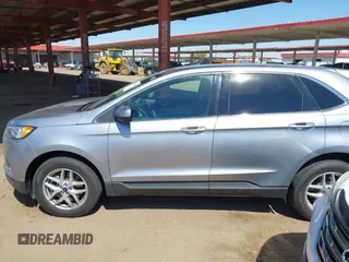 2021 Ford Edge SEL z VIN 2FMPK4J98MBA50772, wystawiony jako IAAI lot #42224052 z przebiegiem 76 061 mil mil oraz . Historia ofert i sprzedaży dostępna na DreamBid. Obrazek 14.