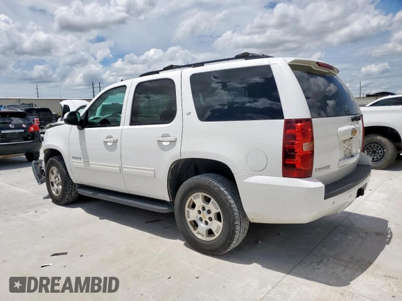 2014 Chevrolet Tahoe LT with VIN 1GNSCBE07ER239575, listed as a Copart auction lot 63094525 with 142,467 mi miles and Salvage title. Bid and sale history available at DreamBid. Image 2.