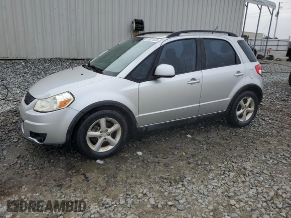 2009 Suzuki SX4 with VIN JS2YB413195101423, listed as a Copart auction lot 85321624 with 127,917 mi miles and Salvage Title. Bid and sale history available at carsss.com. Image 1.
