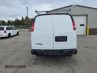 2015 Chevrolet Express Cargo Van with VIN 1GCWGFCF1F1273377, listed as a IAAI auction lot 42154637 with 132,880 mi miles. Bid and sale history available at carsss.com. Image 1.