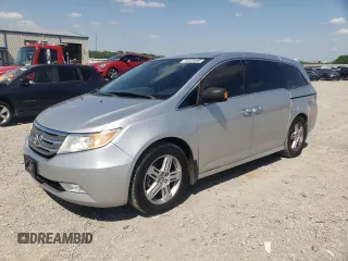 2012 Honda Odyssey Touring with VIN 5FNRL5H94CB009952, listed as a Copart auction lot 54322695 with 135,551 mi miles and Salvage title. Bid and sale history available at DreamBid. Image 1.