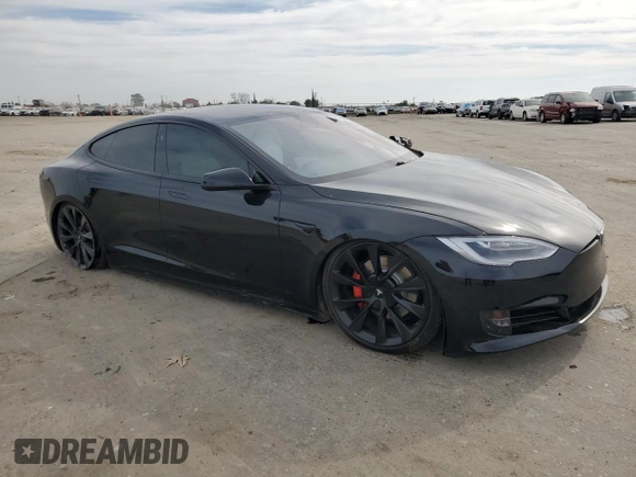 2020 Tesla Model S Performance with VIN 5YJSA1E49LF390948, listed as a Copart auction lot 47313715 with 95,143 mi miles and Salvage title. Bid and sale history available at DreamBid. Image 4.