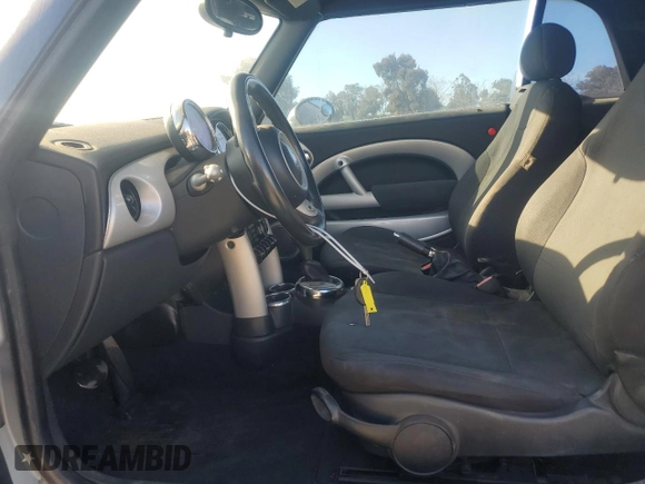 2005 MINI Convertible with VIN WMWRF33465TG10044, listed as a Copart auction lot 50364235 with 152,186 mi miles and Salvage title. Bid and sale history available at DreamBid. Image 7.