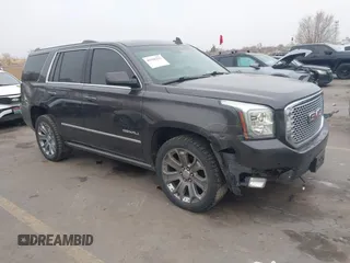 2015 GMC Yukon Denali with VIN 1GKS2CKJ2FR705806, listed as a IAAI auction lot 41568322 with 171,011 mi miles. Bid and sale history available at carsss.com. Image 1.