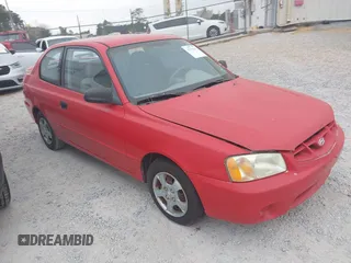 2002 Hyundai Accent GL with VIN KMHCG35C32U157056, listed as a IAAI auction lot 41538381 with 127,518 mi miles. Bid and sale history available at carsss.com. Image 1.