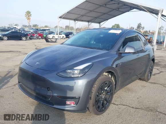 2023 Tesla Model Y Long Range with VIN 7SAYGDEE7PA196038, listed as a IAAI auction lot 41459601 with 16,489 mi miles and . Bid and sale history available at DreamBid. Image 17.