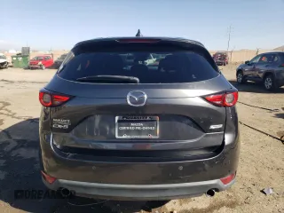 2018 Mazda CX-5 Grand Touring with VIN JM3KFADMXJ1323646, listed as a Copart auction lot 46857825 with 62,262 mi miles and Salvage title. Bid and sale history available at DreamBid. Image 6.