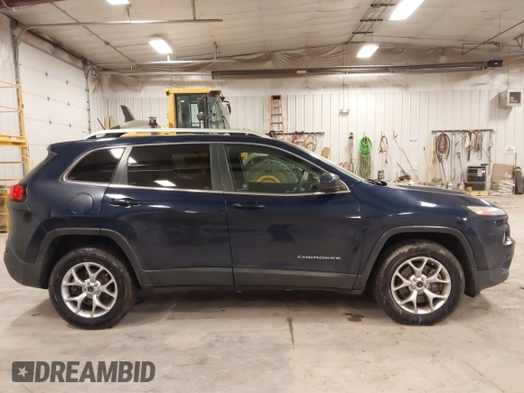 2014 Jeep Cherokee Latitude with VIN 1C4PJMCS9EW239549, listed as a IAAI auction lot 41156954 with 167,331 mi miles and . Bid and sale history available at DreamBid. Image 13.