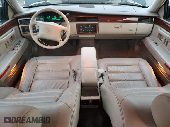 1995 Cadillac DeVille z VIN 1G6KD52B0SU252838, wystawiony jako Copart lot #87642595 z przebiegiem 72 847 mil mil oraz Szkoda całkowita • Salvage title. Historia ofert i sprzedaży dostępna na DreamBid. Obrazek 8.