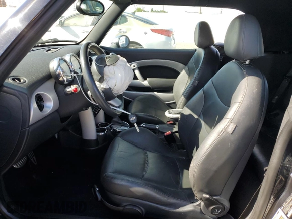 2006 MINI Convertible S with VIN WMWRH33536TK59272, listed as a Copart auction lot 51144475 with 46,024 mi miles and Salvage Title. Bid and sale history available at DreamBid. Image 7.