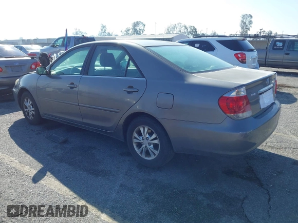 2005 Toyota Camry LE with VIN 4T1BF32K25U603812, listed as a IAAI auction lot 41740671 with 242,316 mi miles and . Bid and sale history available at DreamBid. Image 3.