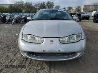 2001 Saturn SC z VIN 1G8ZY14701Z255767, wystawiony jako Copart lot #53727985 z przebiegiem 137 776 mil mil oraz Szkody całkowita. Historia ofert i sprzedaży dostępna na DreamBid. Obrazek 5.