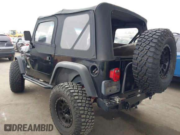 2002 Jeep Wrangler Sport with VIN 1J4FA49S02P705470, listed as a IAAI auction lot 42477770 with 59,395 mi miles and . Bid and sale history available at DreamBid. Image 3.