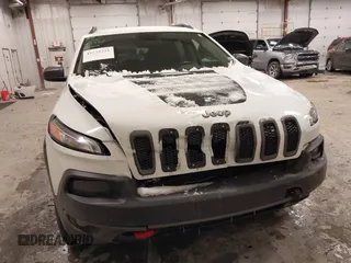 2014 Jeep Cherokee Trailhawk with VIN 1C4PJMBS5EW159912, listed as a IAAI auction lot 41538254 with 166,955 mi miles. Bid and sale history available at carsss.com. Image 12.