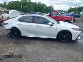 2023 Toyota Camry TRD z VIN 4T1KZ1AK8PU073362, wystawiony jako IAAI lot #42244183 z przebiegiem 103 245 mil mil oraz . Historia ofert i sprzedaży dostępna na DreamBid. Obrazek 14.
