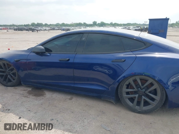 2021 Tesla Model S Plaid with VIN 5YJSA1E64MF442036, listed as a IAAI auction lot 42141304 with 24,998 mi miles and . Bid and sale history available at DreamBid. Image 13.