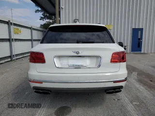 2019 Bentley Bentayga V8 z VIN SJAAM2ZV0KC026362, wystawiony jako Copart lot #54059393 z przebiegiem 31 530 mil mil oraz . Historia ofert i sprzedaży dostępna na DreamBid. Obrazek 6.