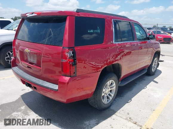 2015 Chevrolet Tahoe LS with VIN 1GNSCAEC4FR121571, listed as a IAAI auction lot 42499156 with 131,284 mi miles and . Bid and sale history available at DreamBid. Image 4.