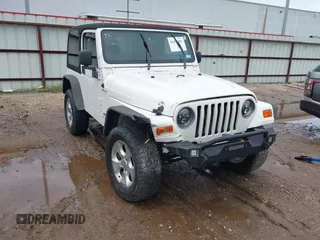 2003 Jeep Wrangler Sport with VIN 1J4FA49S43P362339, listed as a IAAI auction lot 41452901 with 208,128 mi miles and . Bid and sale history available at DreamBid. Image 1.