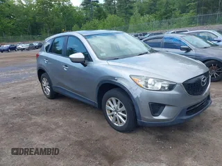 2014 Mazda CX-5 Sport with VIN JM3KE2BEXE0322870, listed as a IAAI auction lot 42352920 with 368,209 mi miles and . Bid and sale history available at DreamBid. Image 1.