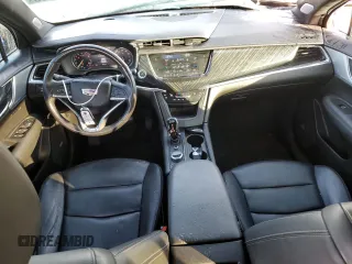 2023 Cadillac XT6 FWD Premium Luxury z VIN 1GYKPCRS6PZ127331, wystawiony jako Copart lot #88802755 z przebiegiem 47 796 mil mil oraz Szkoda całkowita • Salvage title. Historia ofert i sprzedaży dostępna na DreamBid. Obrazek 8.