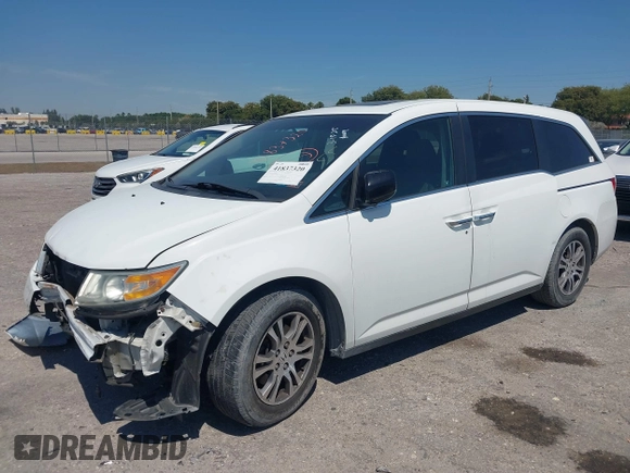 2012 Honda Odyssey EX-L with VIN 5FNRL5H61CB019215, listed as a IAAI auction lot 41837320 with 248,498 mi miles and . Bid and sale history available at DreamBid. Image 2.