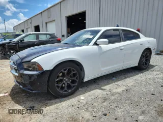 2012 Dodge Charger Police with VIN 2C3CDXAT8CH247922, listed as a Copart auction lot 63423145 with 104,601 mi miles and Clean title. Bid and sale history available at DreamBid. Image 1.