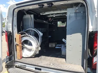 2018 Ford Transit with VIN 1FTYE1YM6JKB52209, listed as a IAAI auction lot 42801071 with 159,984 mi miles and . Bid and sale history available at DreamBid. Image 13.