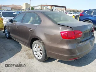 2014 Volkswagen Jetta SE with VIN 3VWD17AJ7EM385606, listed as a IAAI auction lot 42575046 with 86,889 mi miles and . Bid and sale history available at DreamBid. Image 3.