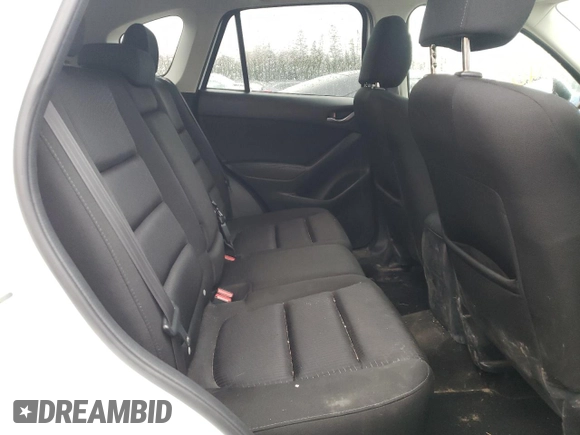 2014 Mazda CX-5 Touring z VIN JM3KE4CY1E0406726, wystawiony jako Copart lot #54652065 z przebiegiem 245 491 mil mil oraz Szkoda całkowita • Salvage title. Historia ofert i sprzedaży dostępna na DreamBid. Obrazek 11.