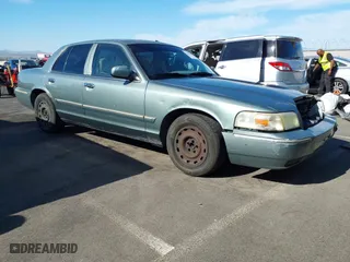 2006 Mercury Grand Marquis GS with VIN 2MEFM74V16X650056, listed as a IAAI auction lot 42107815 with 156,710 mi miles. Bid and sale history available at carsss.com. Image 1.