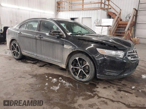 2014 Ford Taurus SEL with VIN 1FAHP2E87EG117653, listed as a IAAI auction lot 41589415 with 125,040 mi miles. Bid and sale history available at carsss.com. Image 1.