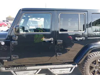 2014 Jeep Wrangler Unlimited Sahara with VIN 1C4BJWEG0EL306202, listed as a IAAI auction lot 41784330 with 79,123 mi miles. Bid and sale history available at carsss.com. Image 14.