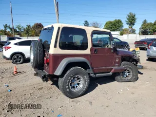 2002 Jeep Wrangler Sahara with VIN 1J4FA59S22P704603, listed as a Copart auction lot 77554334 with 99,758 mi miles and Salvage Title. Bid and sale history available at carsss.com. Image 3.