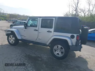 2009 Jeep Wrangler Unlimited Sahara with VIN 1J4GA59129L780013, listed as a IAAI auction lot 41976308 with 164,738 mi miles. Bid and sale history available at carsss.com. Image 3.