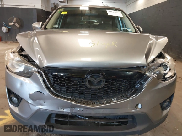 2014 Mazda CX-5 Grand Touring with VIN JM3KE4DY9E0373974, listed as a IAAI auction lot 42073693 with 86,755 mi miles. Bid and sale history available at carsss.com. Image 6.