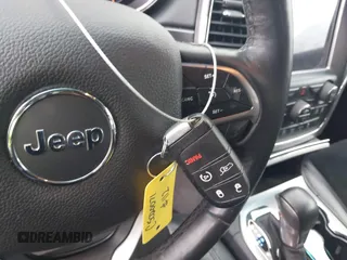 2018 Jeep Grand Cherokee Laredo E with VIN 1C4RJEAG0JC218694, listed as a IAAI auction lot 41587665 with 97,618 mi miles. Bid and sale history available at carsss.com. Image 11.